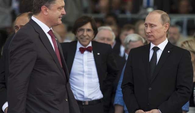  Preşedinţii Rusiei şi Ucrainei şi-au strâns mâna la reuniunea de la Minsk