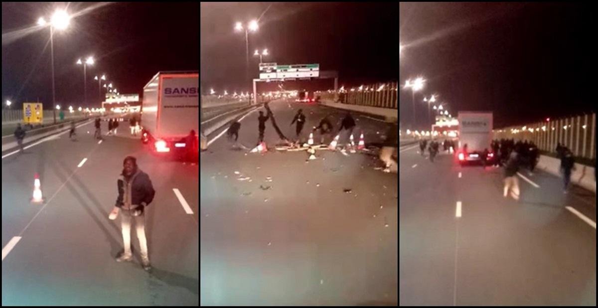  VIDEO BLOCADA CALAIS în drum spre Anglia. Şofer român de TIR, blocat de migranți înarmați cu pietre, în Franța