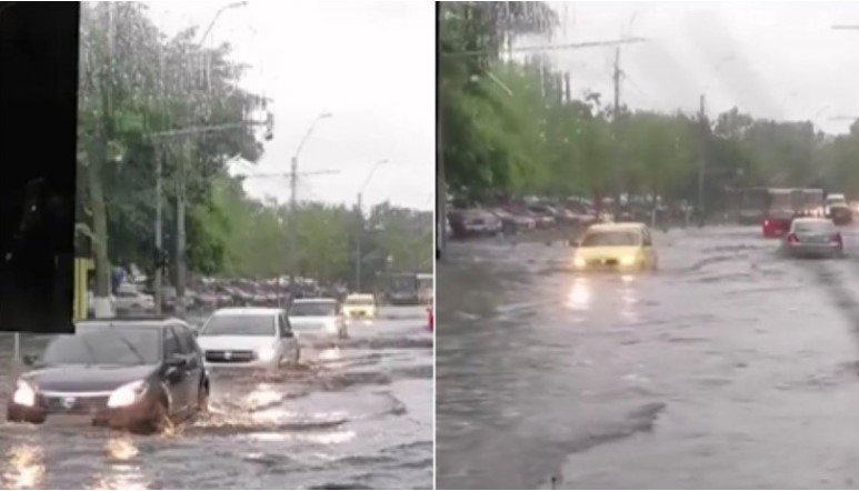  Inundaţii masive în capitală. Nivelul apei aproape ajunge la capota maşinilor (FOTO)